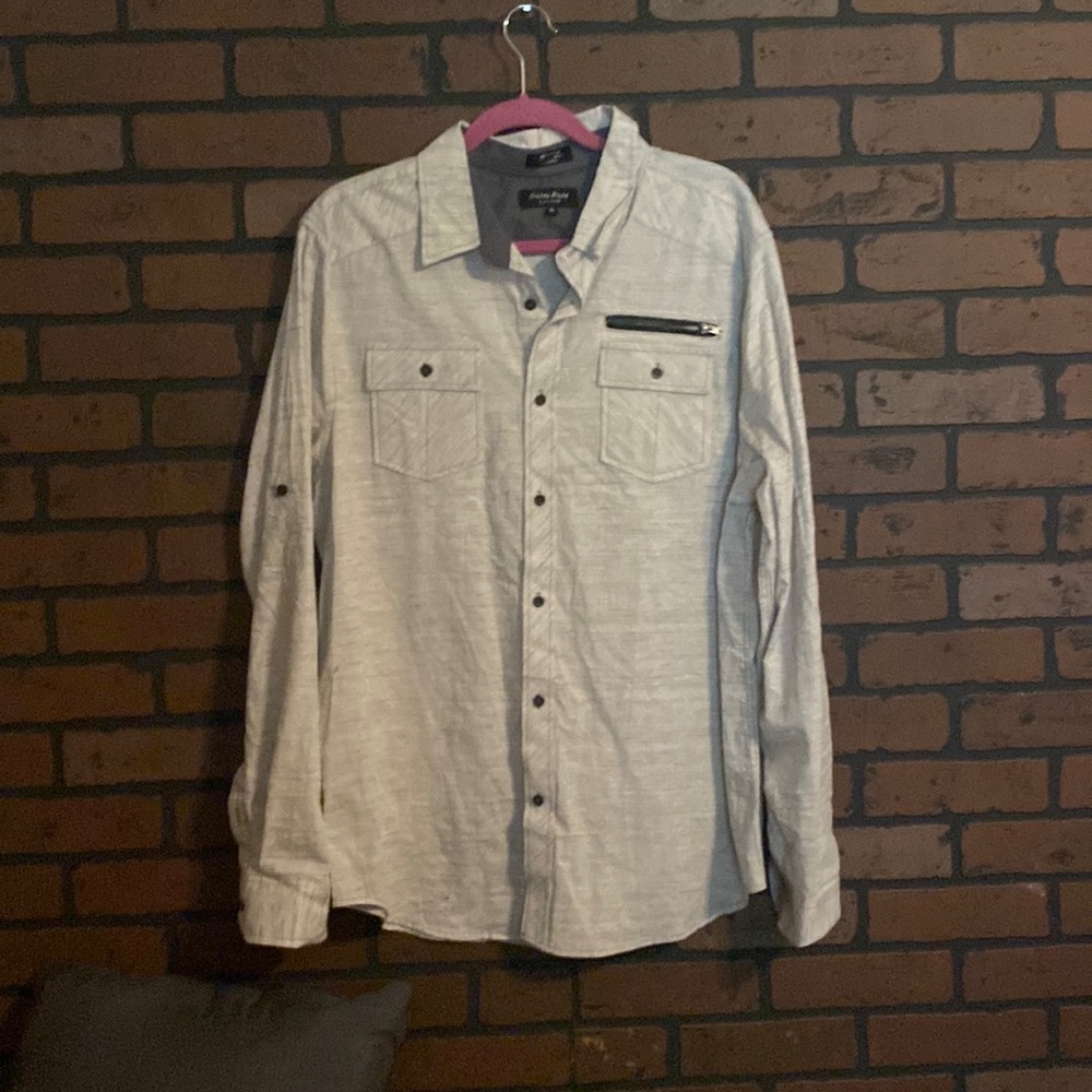 A casual gray long sleeve button down shirt